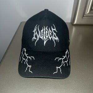 Black “Born In Darcness” Darc Sport Hat with White Graphic Design.